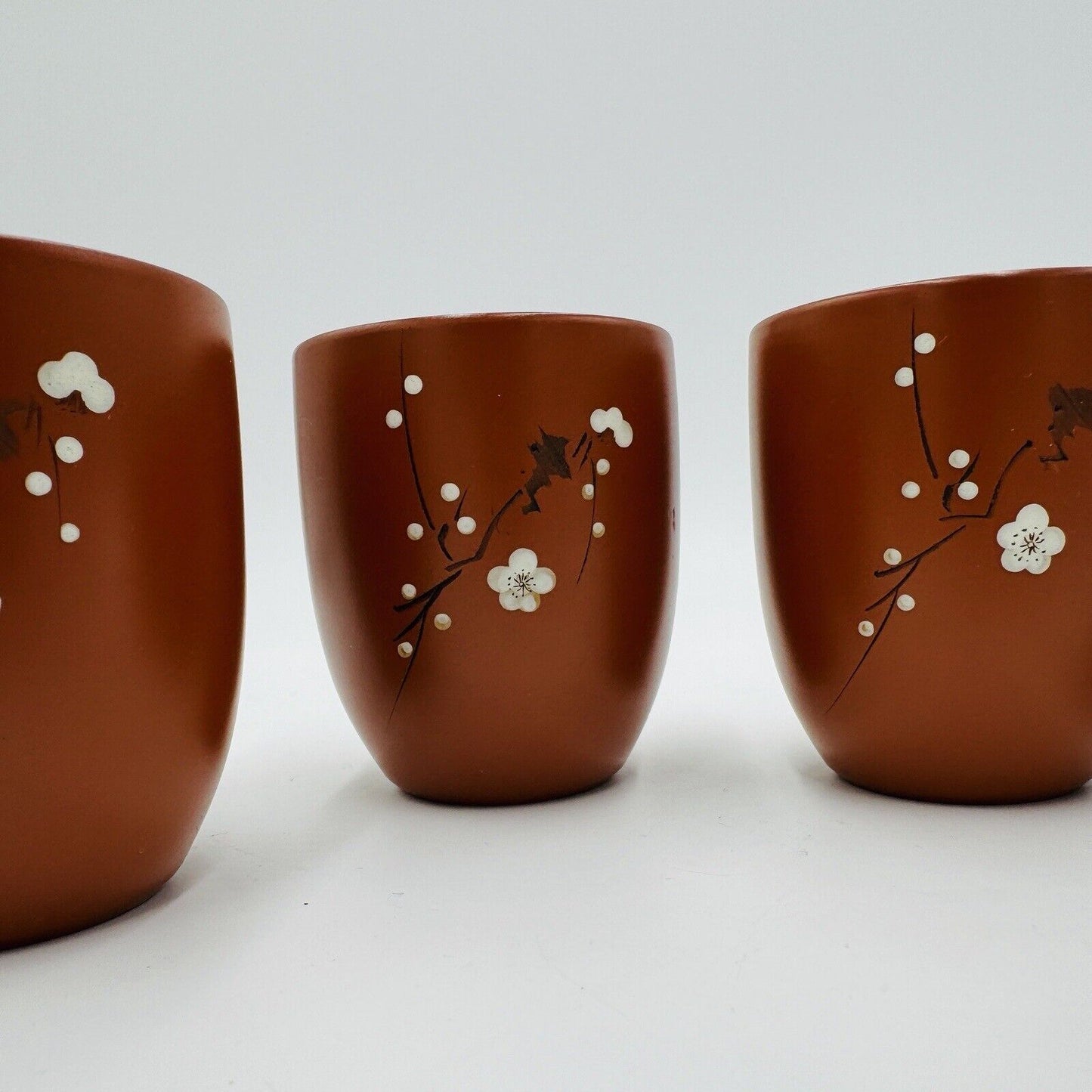 Yizing zisha zhu terracota plum floral tea cups set Signed 4 Pieces