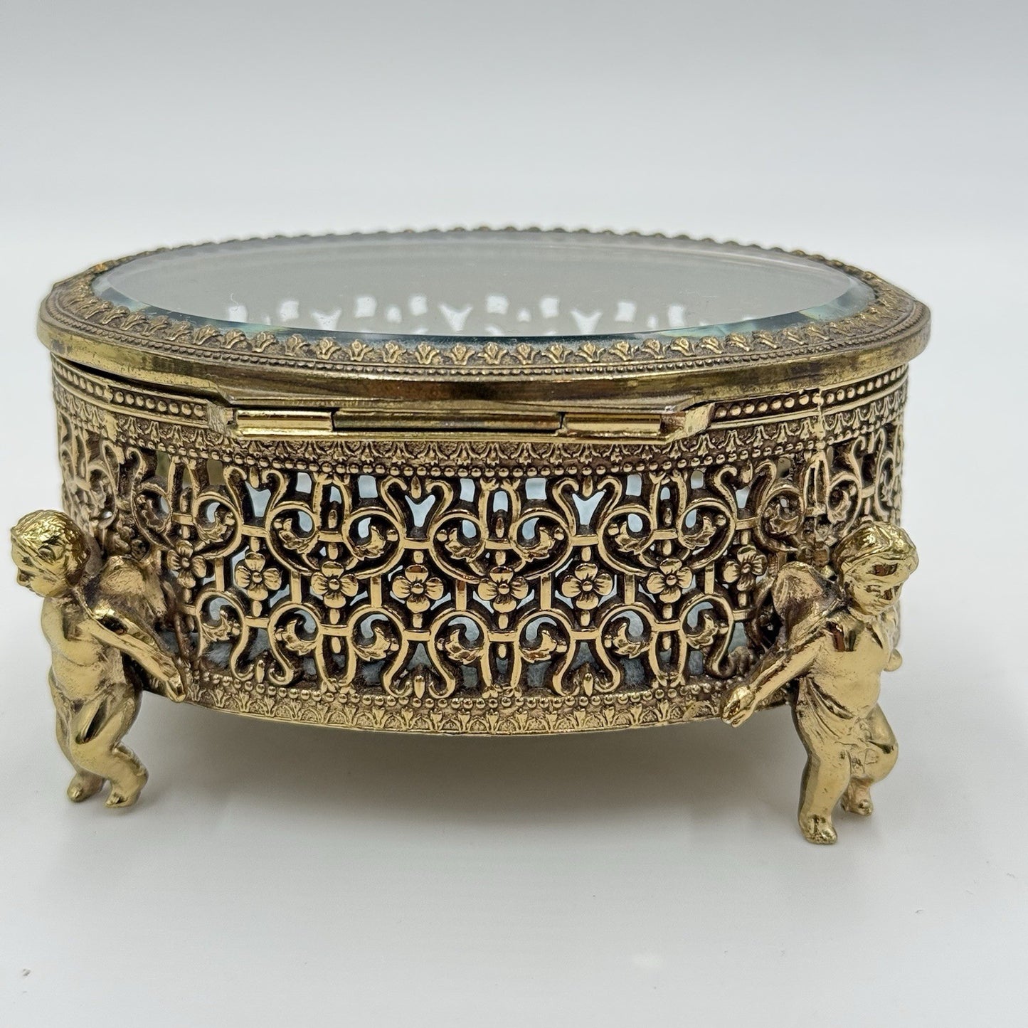 Vintage Gold Filigree Oval Ormolu casket Hollywood Regency style Cherubs Footed