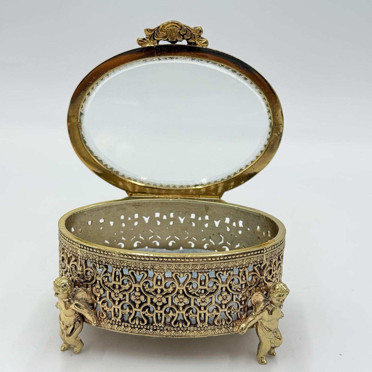 Vintage Gold Filigree Oval Ormolu casket Hollywood Regency style Cherubs Footed