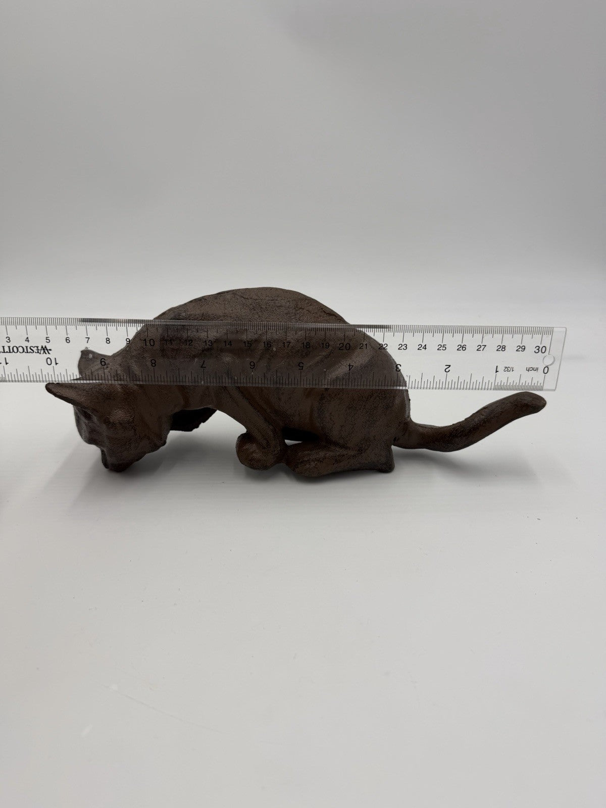 vintage cast iron cat shelf sitter with a rustic antique brown finish 10”Lx4”H