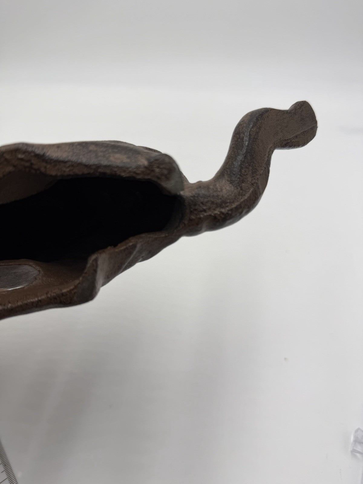 vintage cast iron cat shelf sitter with a rustic antique brown finish 10”Lx4”H