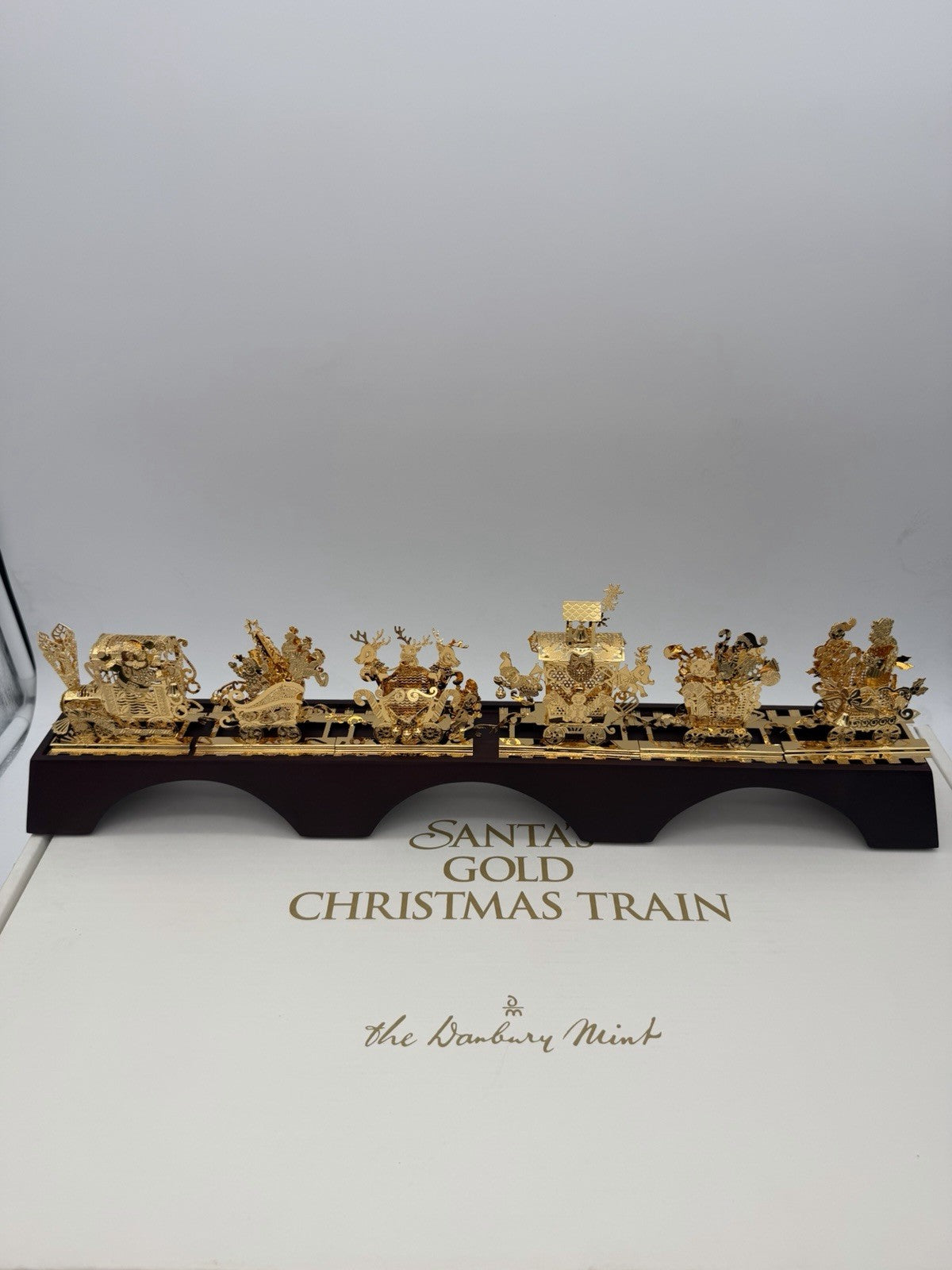The Danbury Mint Santa’s Gold Christmas Train 24k Gold Finish Complete Wood Base