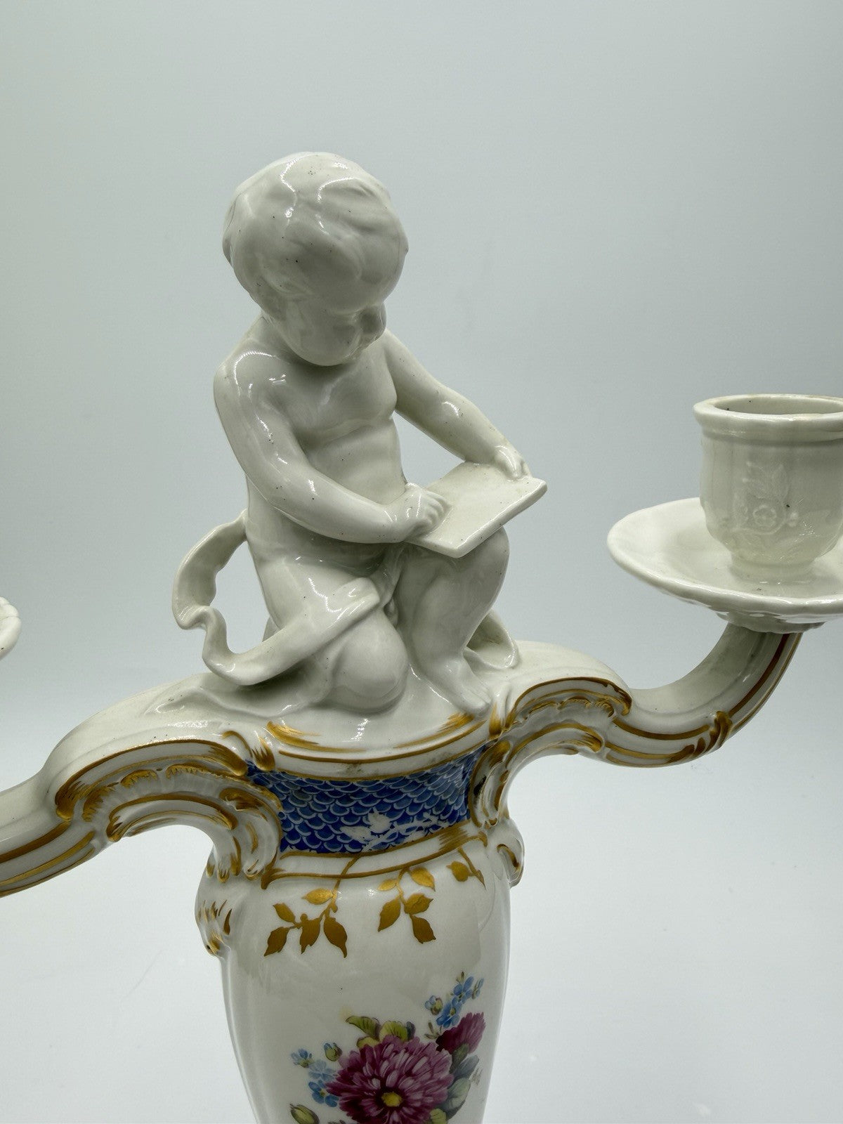 Rare 19th C KPM Berlin Rocaille porcelain candelabra kneeling reading putto 14”