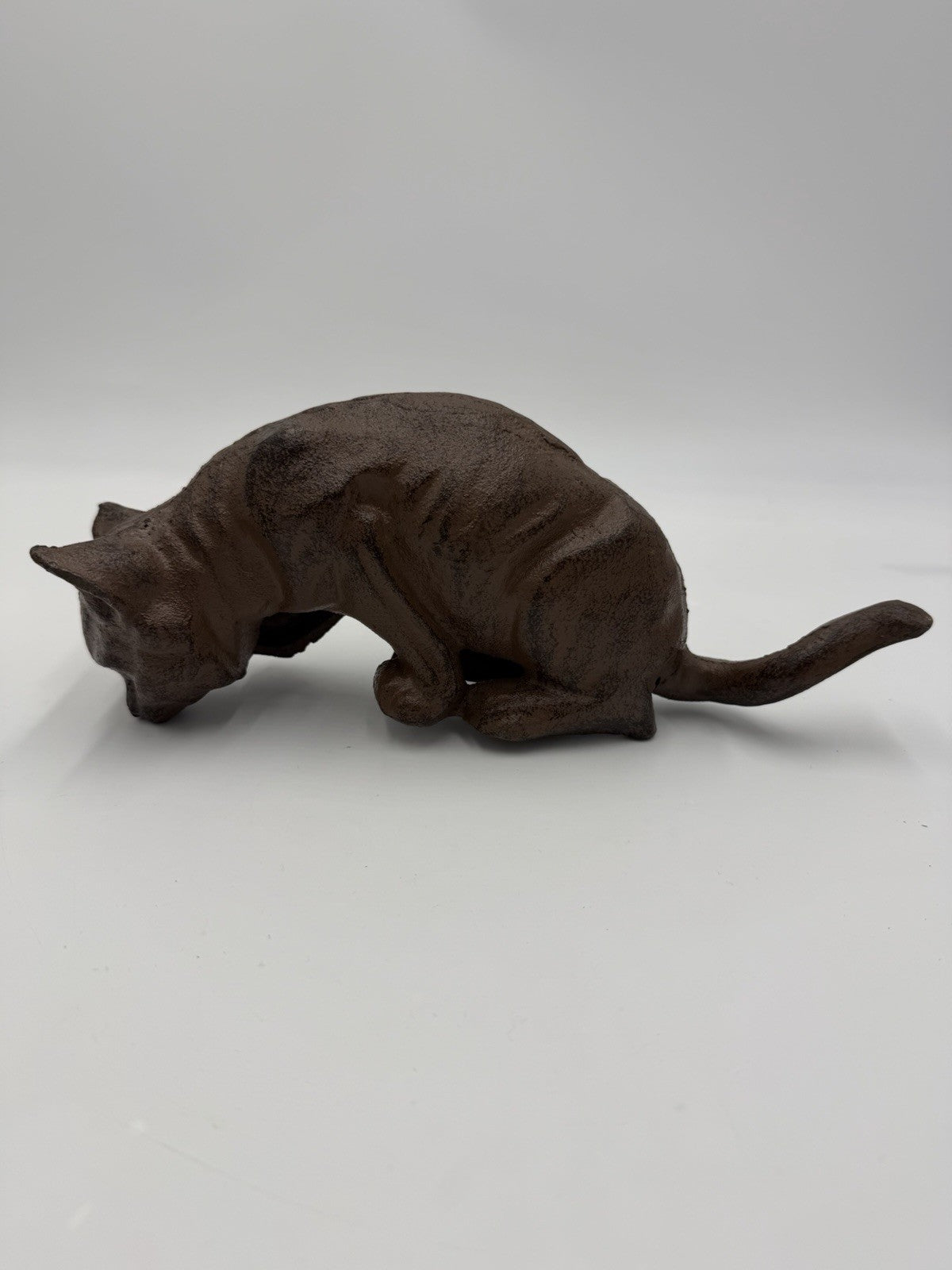vintage cast iron cat shelf sitter with a rustic antique brown finish 10”Lx4”H
