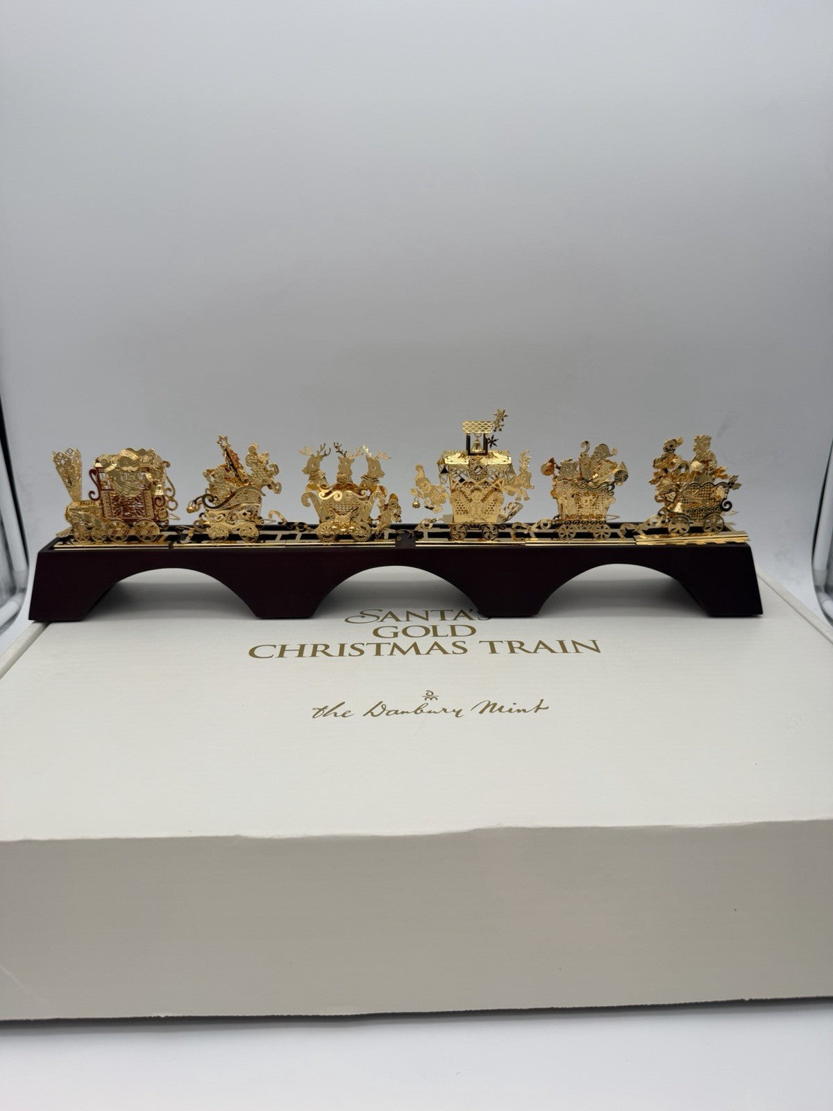 The Danbury Mint Santa’s Gold Christmas Train 24k Gold Finish Complete Wood Base