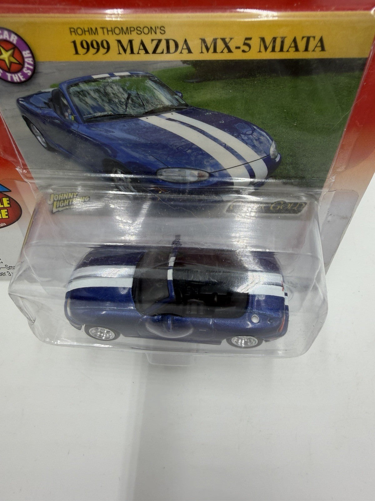 Johnny Lightning Classic Gold Rohm Thompson's 1999 Mazda MX-5 Miata Sealed