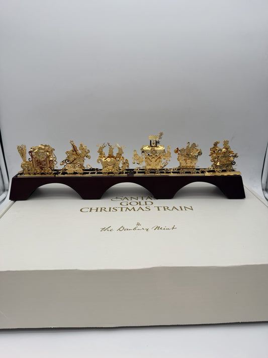The Danbury Mint Santa’s Gold Christmas Train 24k Gold Finish Complete Wood Base