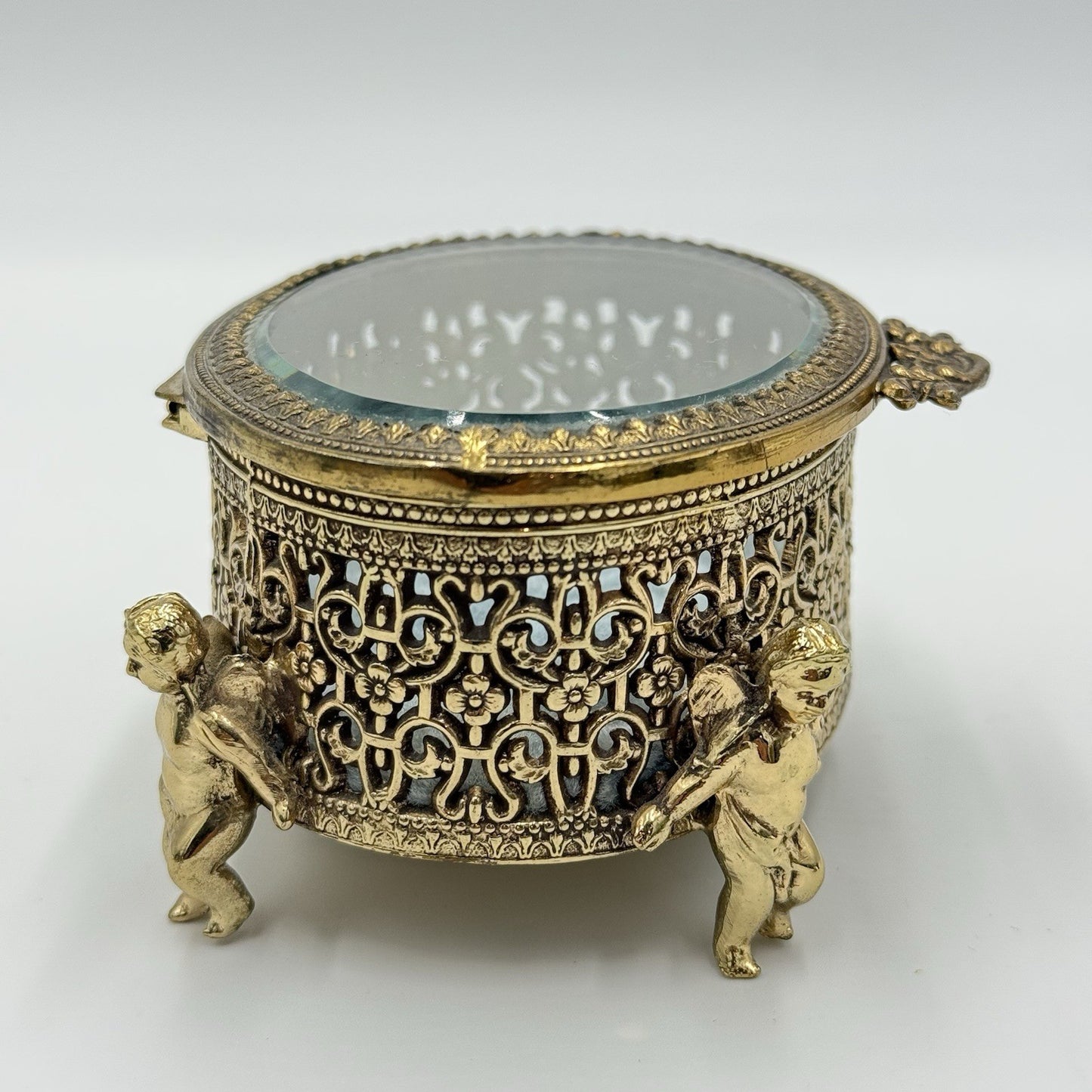 Vintage Gold Filigree Oval Ormolu casket Hollywood Regency style Cherubs Footed