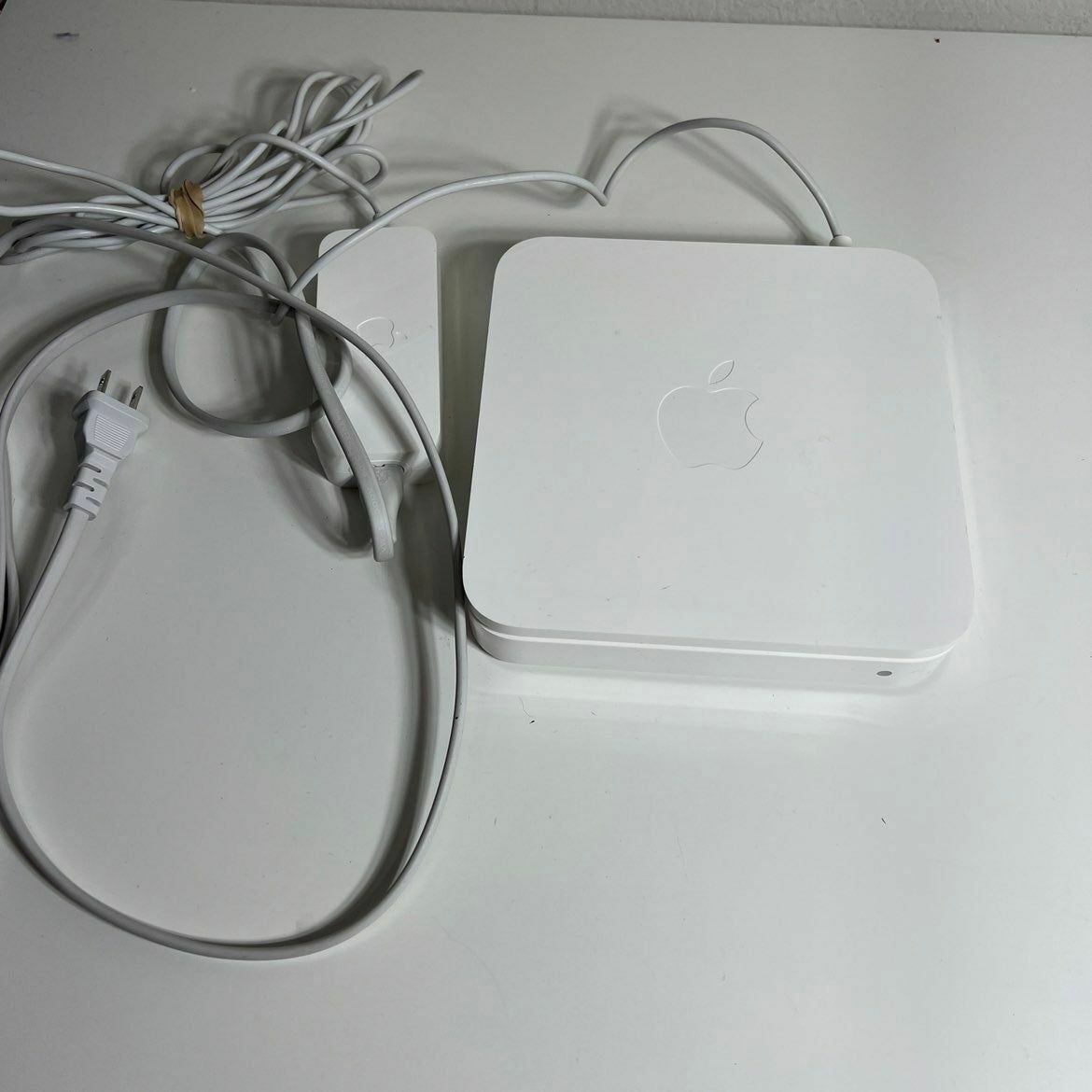 a white apple computer sitting on top of a table