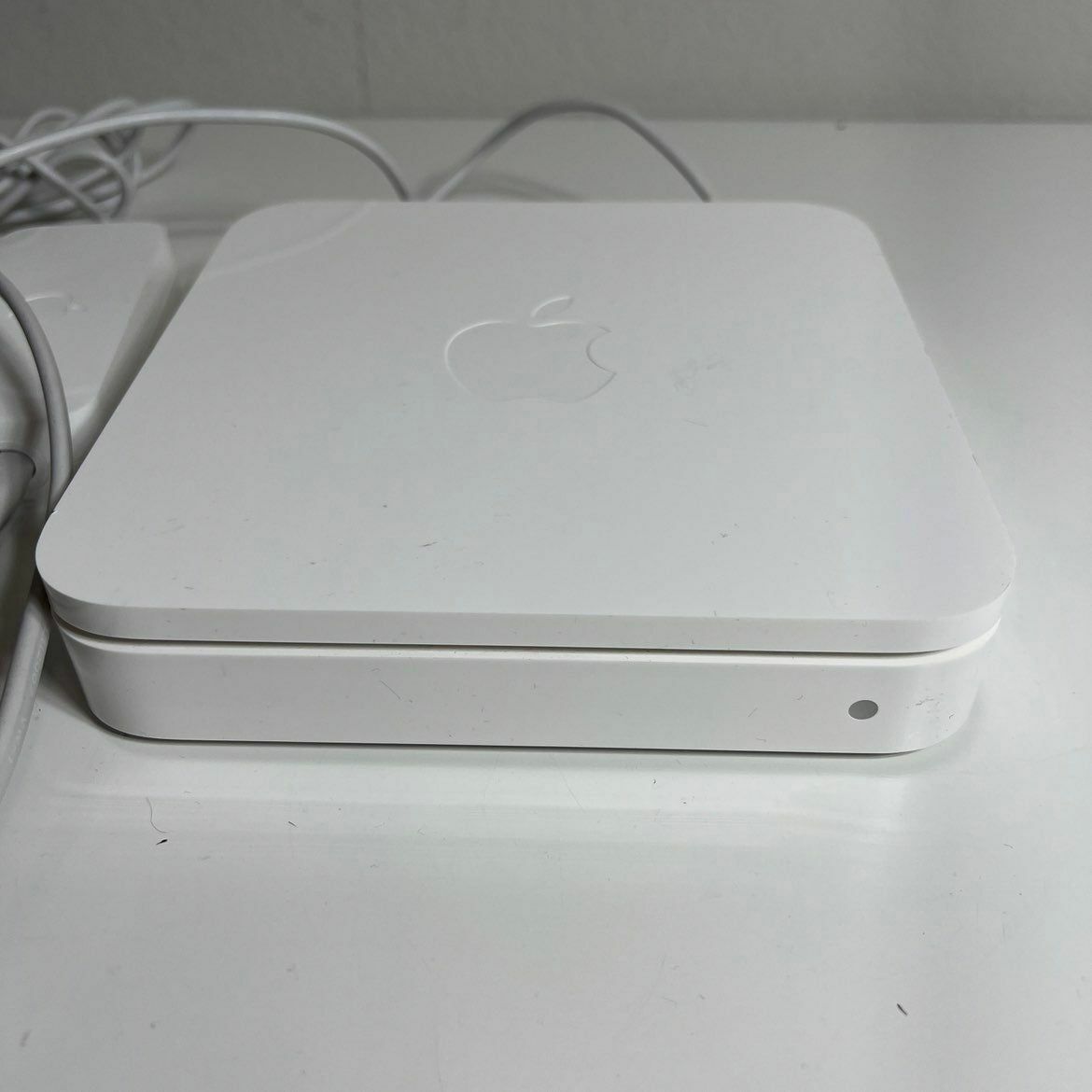 a white apple computer sitting on top of a table